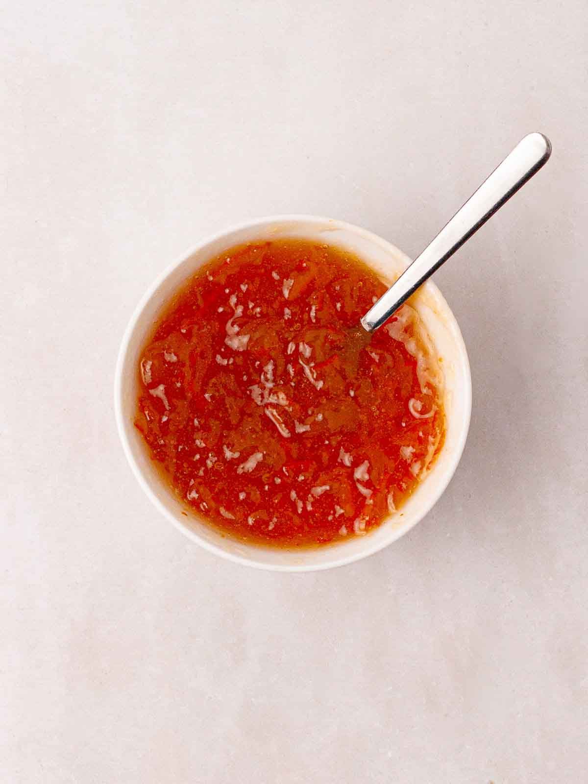 A bowl of marmalade and honey mixed together to make a glaze for Air Fryer Gammon Joint.