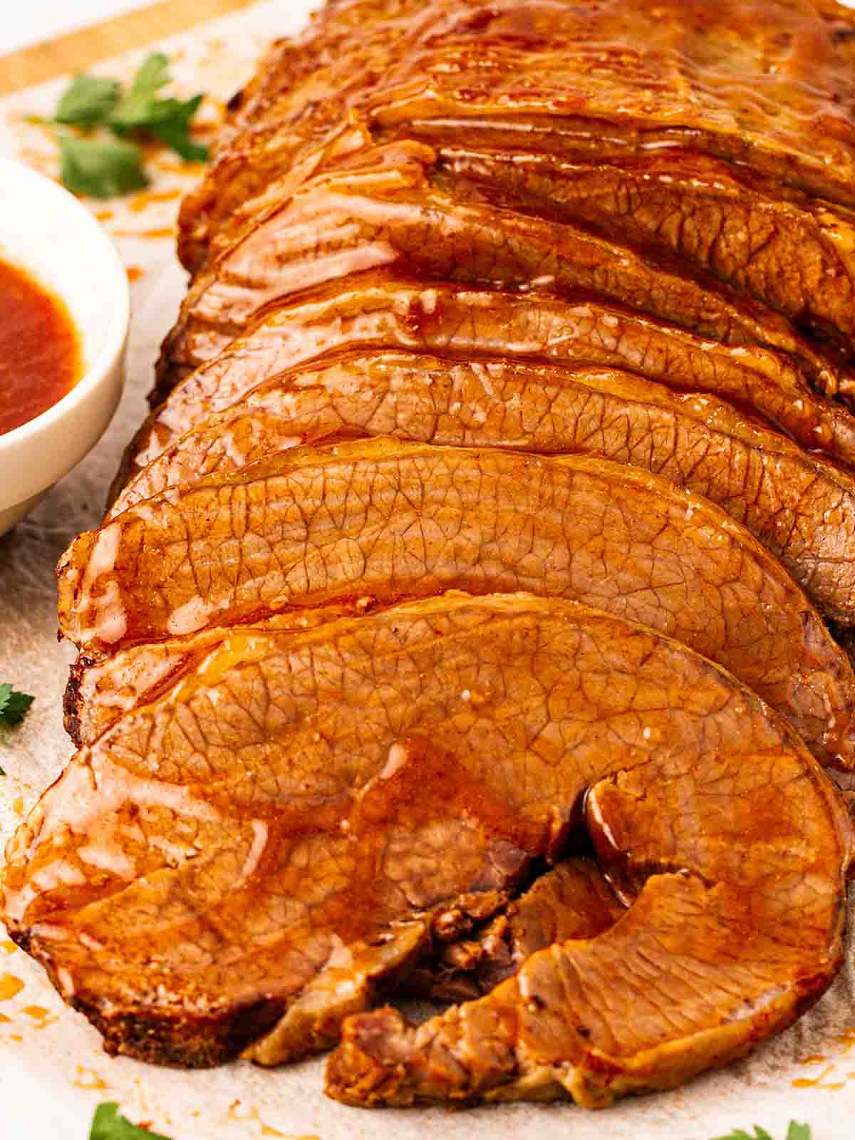 Slices of beef brisket in gravy, ready to be served up.