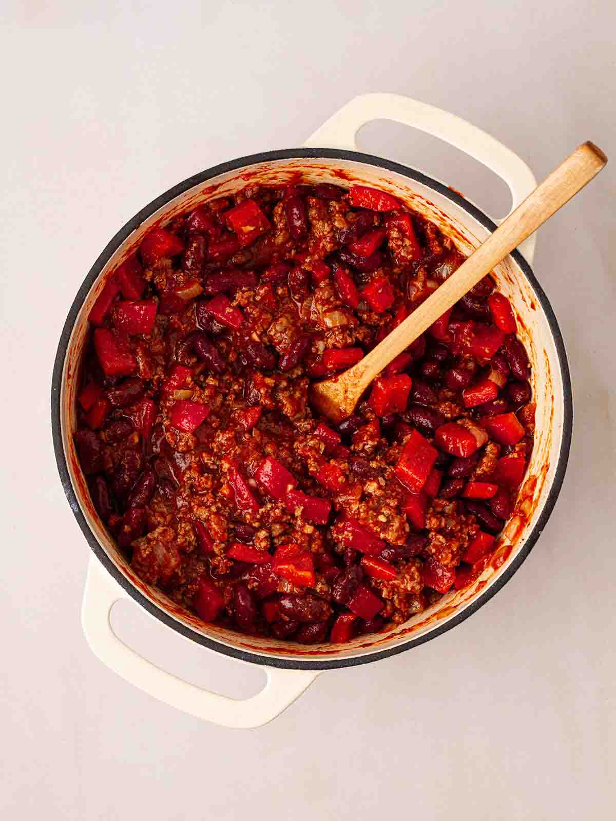 A pan filled with a chill sauce for step 3 in the recipe for Beef Enchiladas.