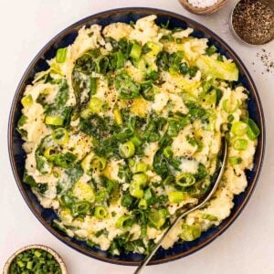 A bowl filled with a bowl of Colcannon mashed potato.