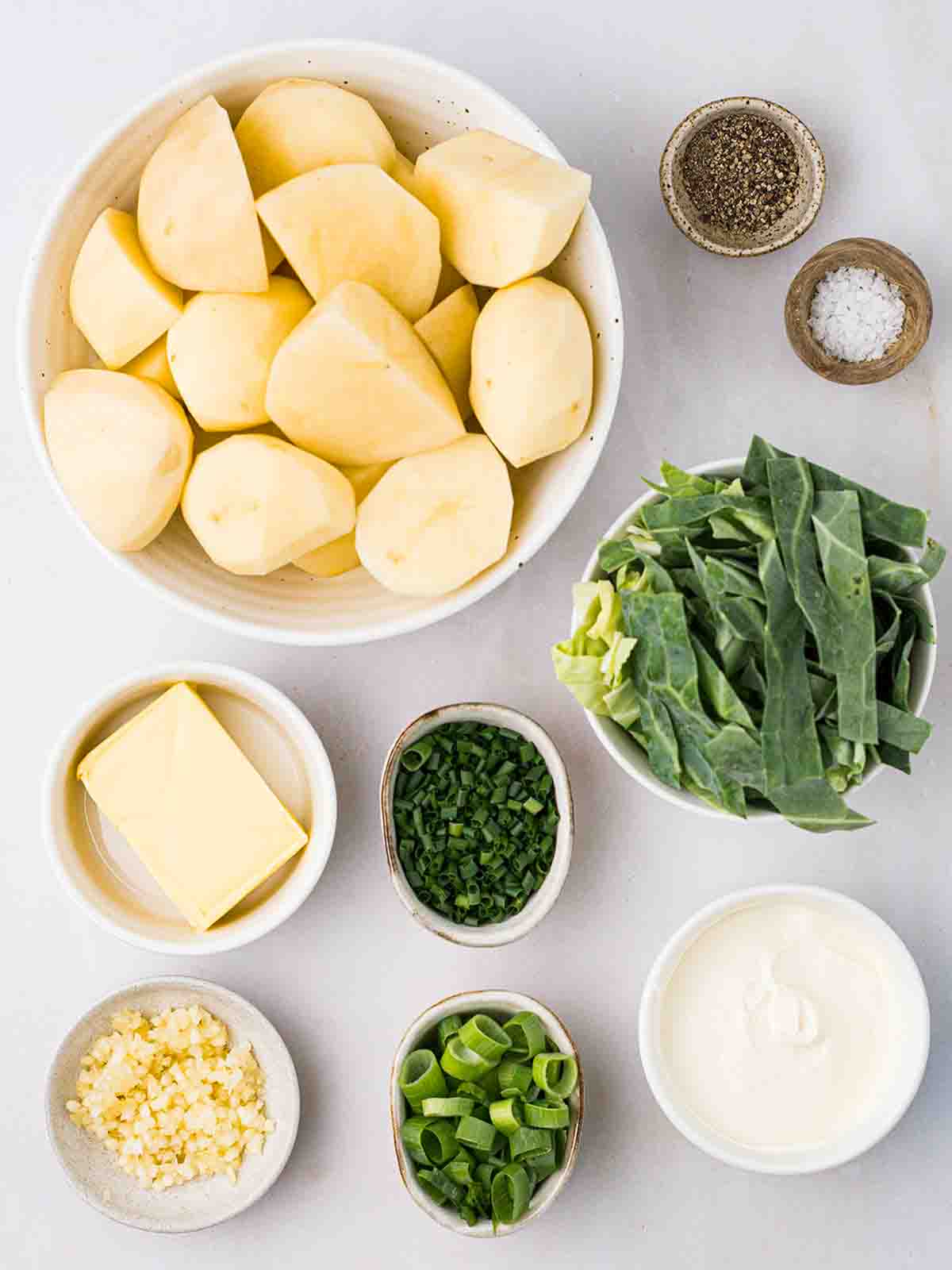The ingredients for Colcannon Irish mashed potato laid out on a white counter.