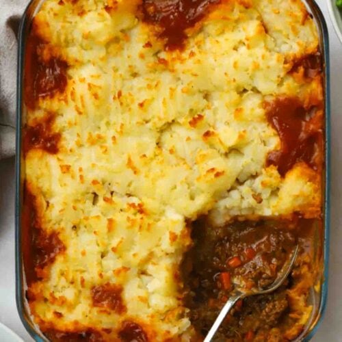 A cottage pie straight out of the oven being served.