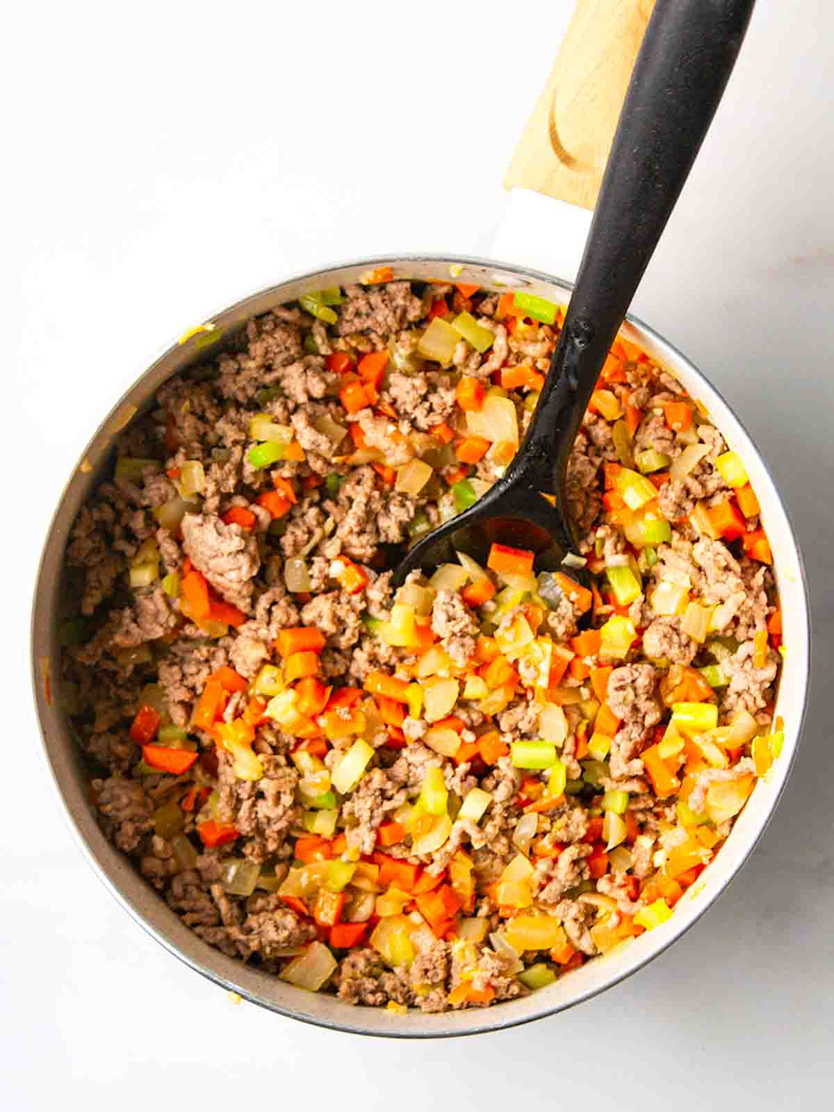 Beef with mixed vegetables in a pan for step 2 in the recipe for Cottage Pie.