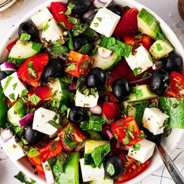 A classic Greek Salad close up, with olives, tomatoes, cucumber, pepper and feta.