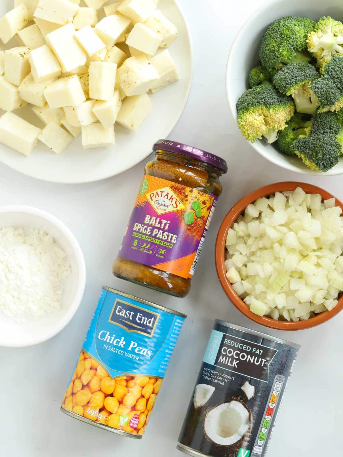 Ingredients for a Halloumi Curry laid out on a counter.