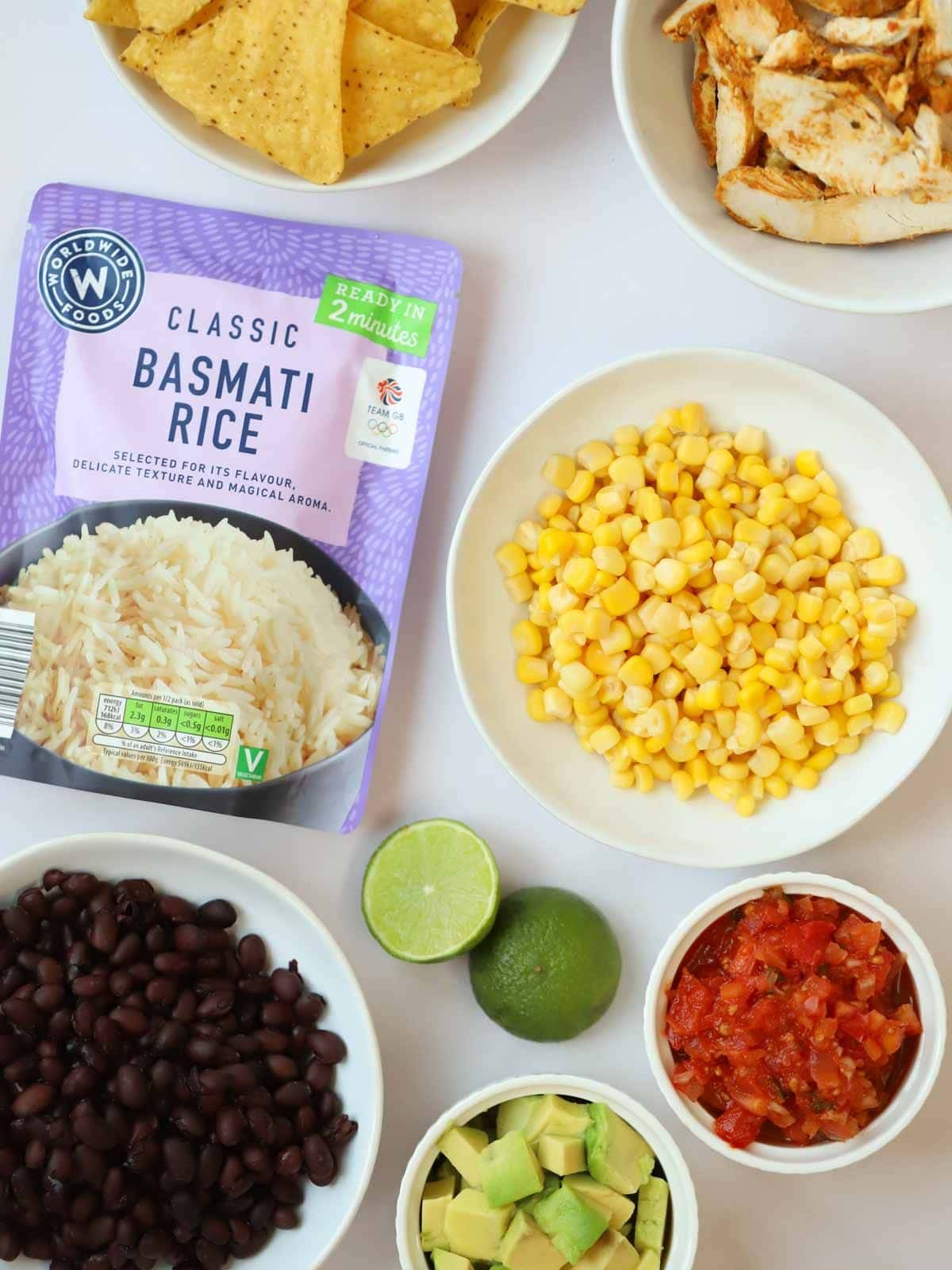 The ingredients for Burrito Bowls recipe laid out on a counter.