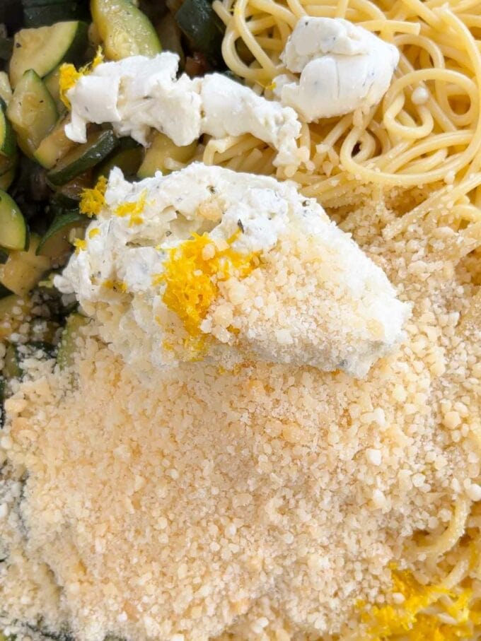 Step 2 in the recipe for Courgette Pasta. Combine ingredients together and stir.