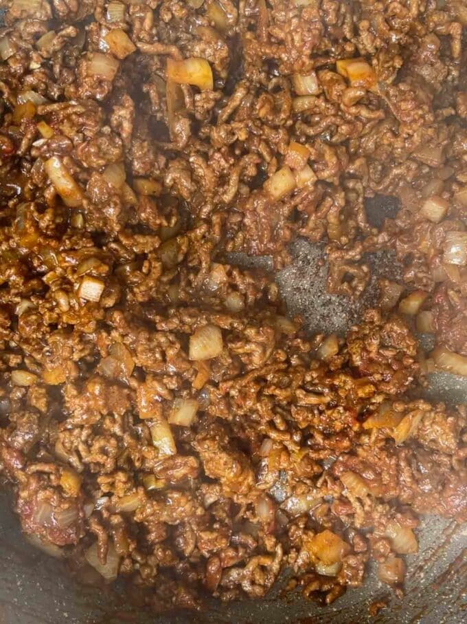 How to make Beef Burritos. Step 2. Beef mince, onion and spices cooked together in a pan.