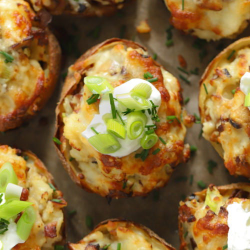 Loaded potato skins topped with sour cream and cheese and bacon