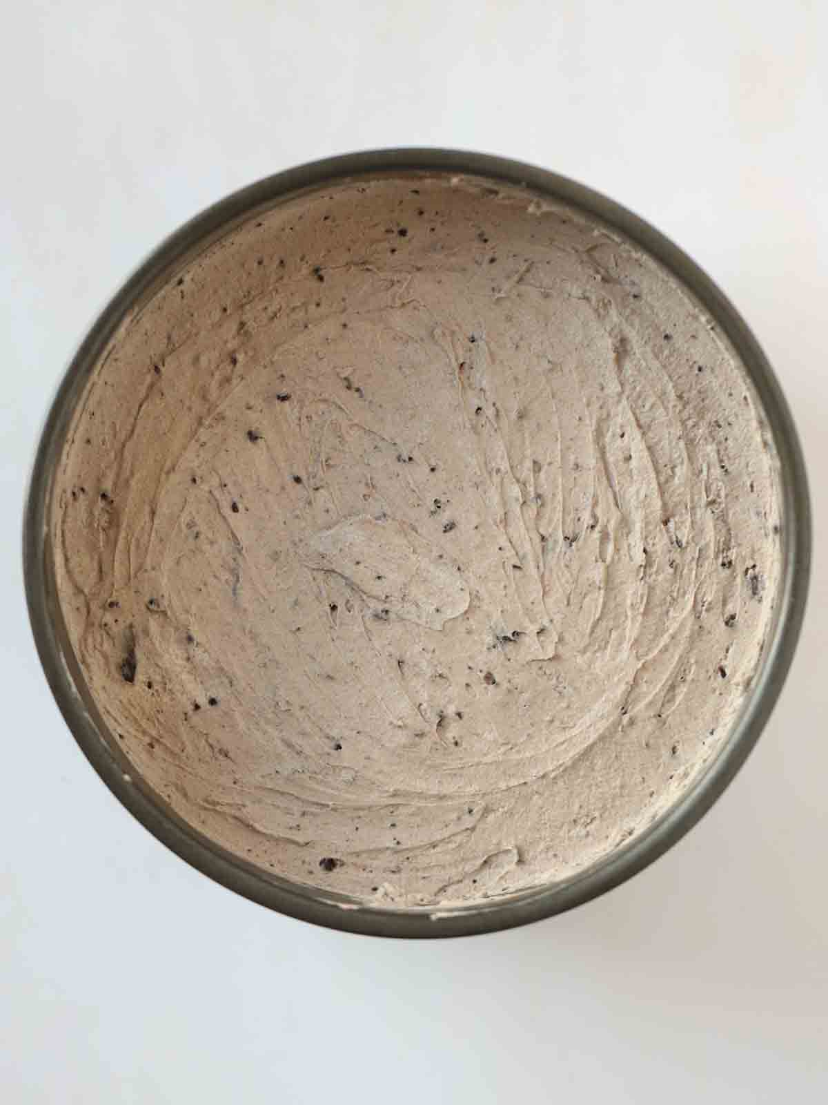 Looking down on a tin of Oreo Cheesecake filling, ready to set.