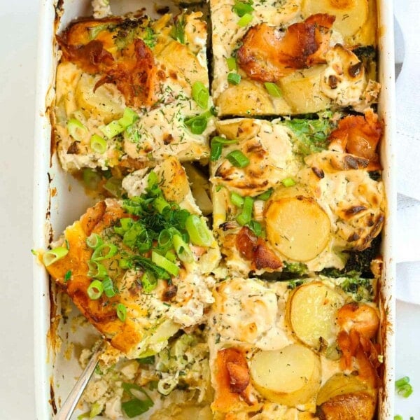 Sliced salmon bake with potatoes and broccoli.
