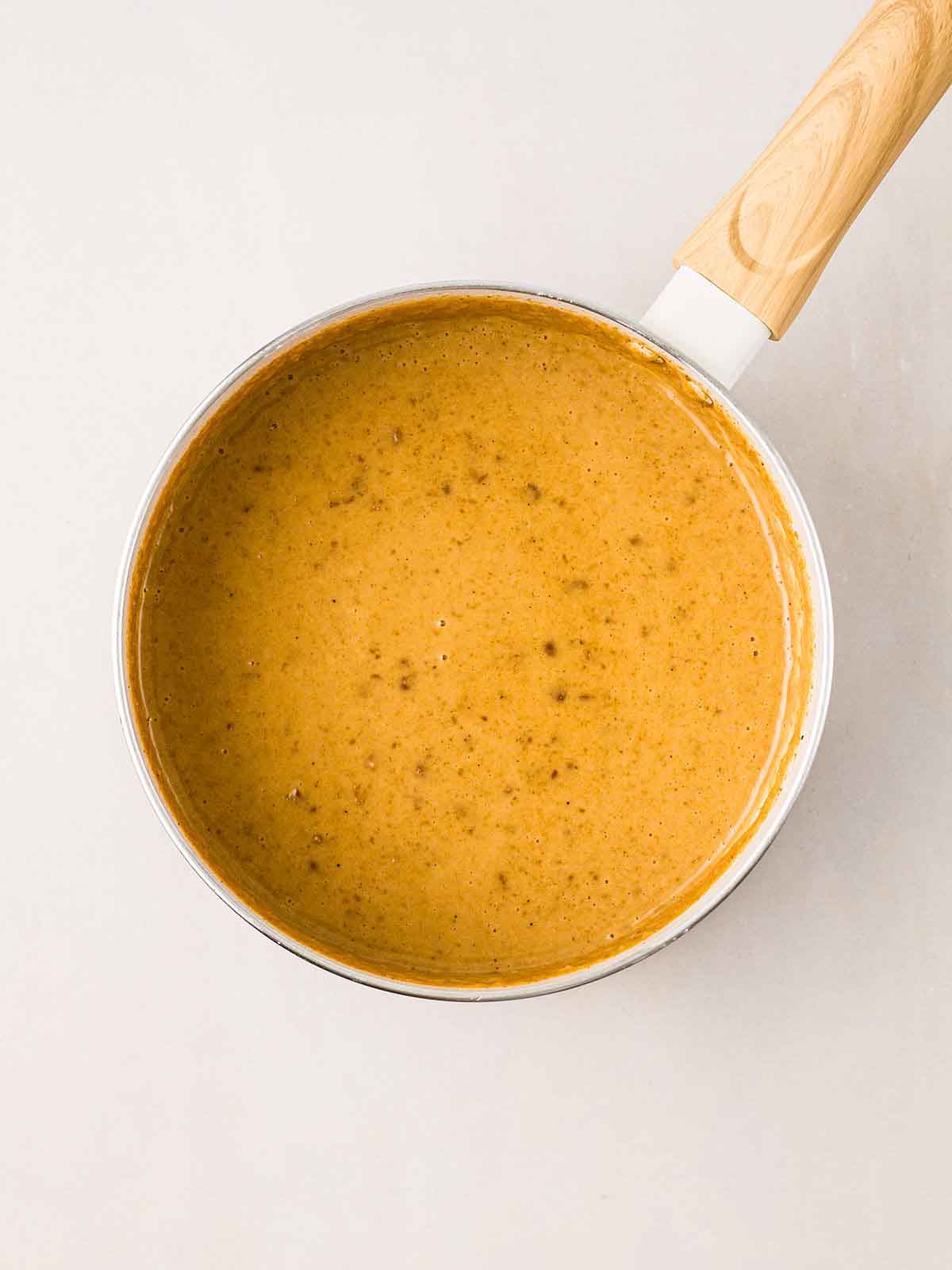 A pan filled with homemade Satay Sauce.