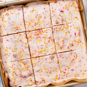 A square School Cake sponge with icing and sprinkles over the top, but into squares.