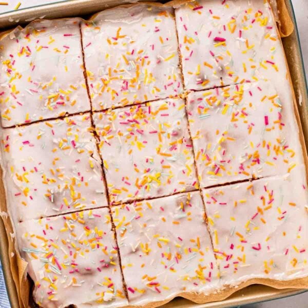 A square School Cake sponge with icing and sprinkles over the top, but into squares.