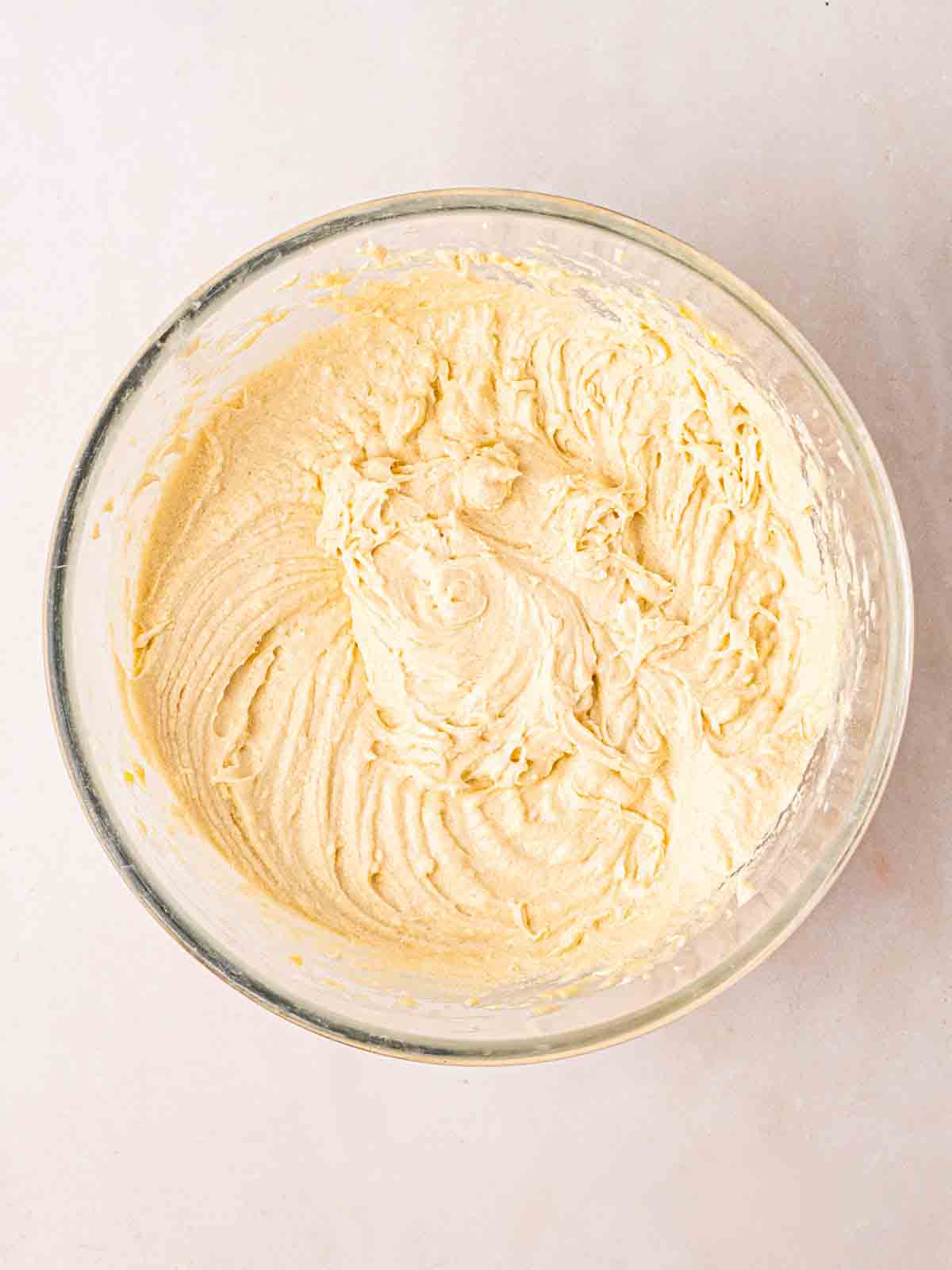 A cake mixture in a glass bowl.