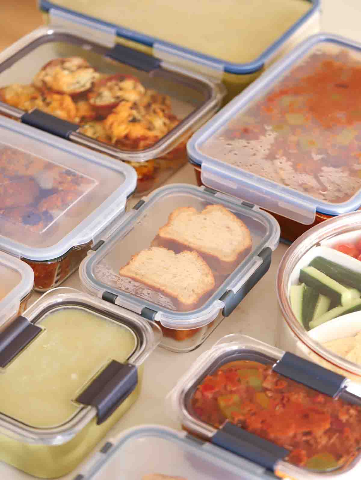Overhead filled meal prep containers on a kitchen work surface.