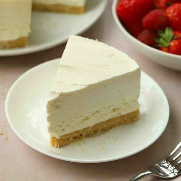 A slice of no bake vanilla cheesecake on a plate.